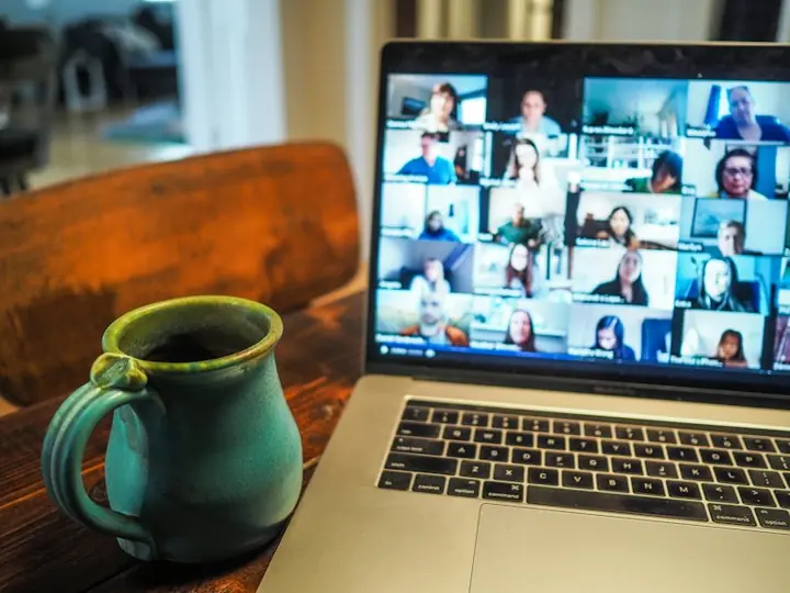 A laptop showing a team video meeting