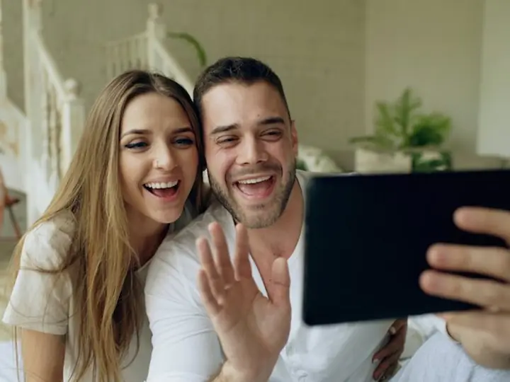 A couple on a video call on a tablet